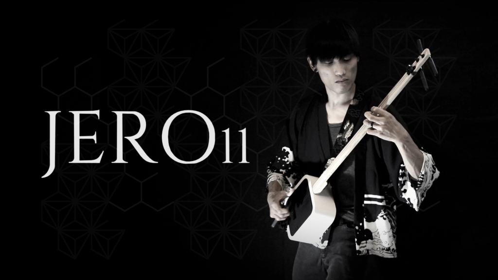 Promotional photo of Jero playing his box shamisen